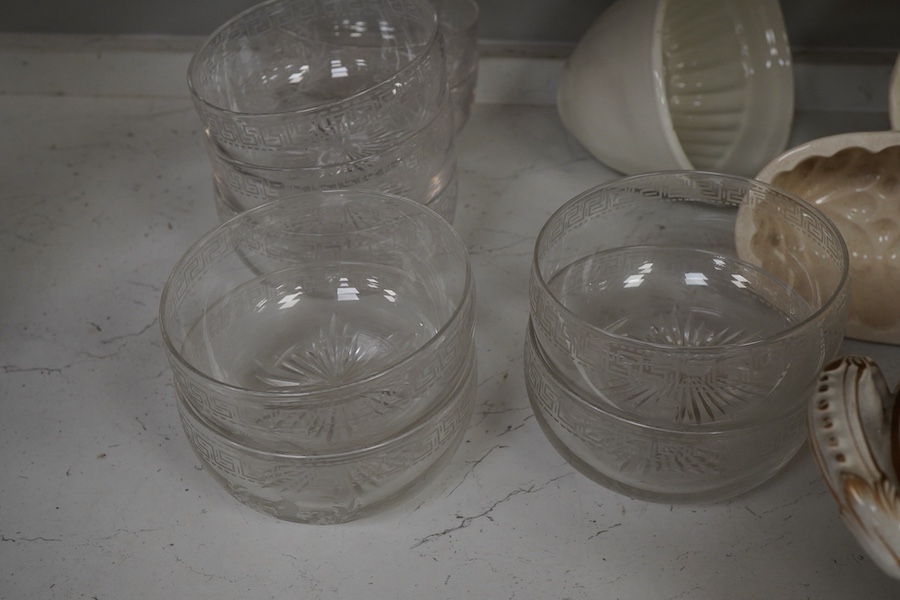 A 19th century tureen, ceramic jelly moulds and a set of glass rinsers, largest 39cm wide